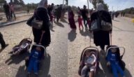 شاهد أم فلسطينية تجر طفليها لأكثر من 5 ساعات خلال نزوحها من غزة